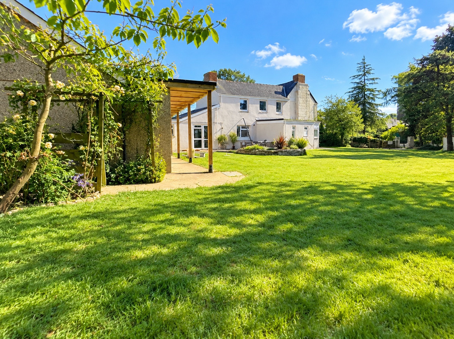 Our House viewed across its spacious green garden